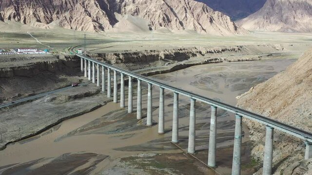 aerial video of the railway bridge over kunlun river on qinghai-tibet plateau, golmud city, China