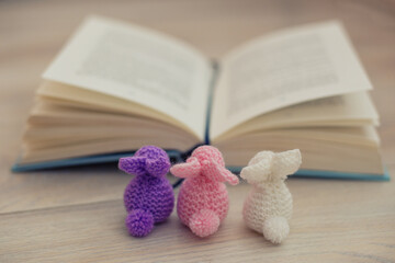 knitted bunnies with book