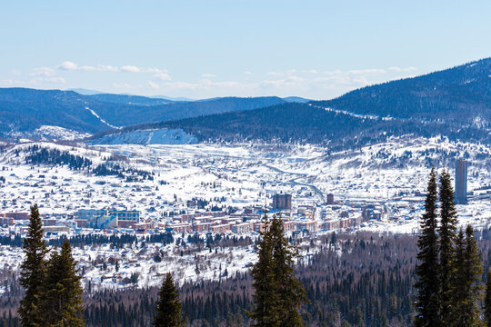 A mountain valley on which at the foot of the mountains there is a small provincial town of Sheregesh 