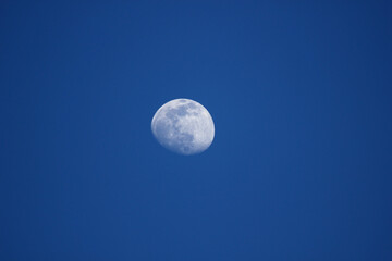 full moon in the blue sky