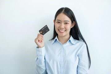 The hand of an Asian woman holding a credit card is used for online shopping and Internet payments