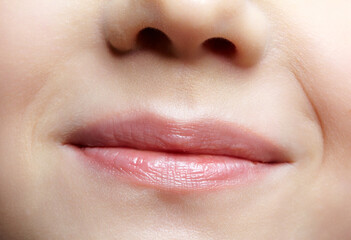 Obraz premium Human mouth and nose. Closeup macro portrait of young female teenager part of face