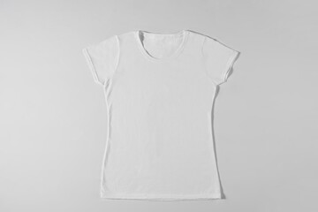 White womens T-shirt on light background