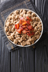 Traditional dish of Slovenia is Ajdovi Zganci close-up in a bowl on the table. vertical top view from above