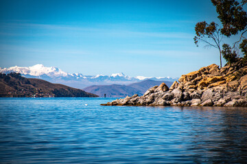 lake titicaca with andes in background, bolivian side, bolivia, peru - obrazy, fototapety, plakaty