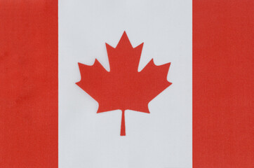 national flag of Canada on a fabric base close-up
