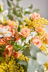 Finished flower arrangement in a vase for home. Flowers bunch, set for interior. Fresh cut flowers for decoration home. European floral shop. Delivery fresh cut flower.