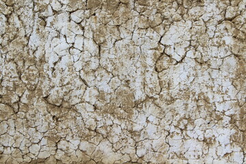 White Dirty Cracked Texture Background of Old Barn Clay Wall covered with Lime