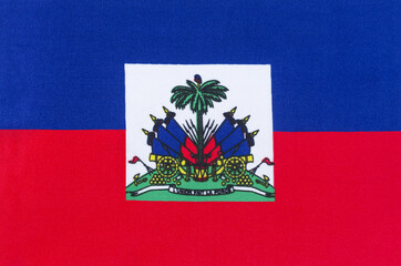 national flag of the Republic of Haiti on a fabric base close-up