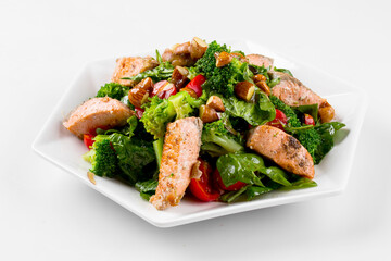 Isolated salmon salad with herbs and almonds on the white background