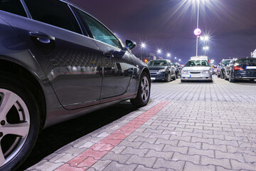 Car parking. Empty road asphalt background. Car lot parking space in underground city garage. Urban, Rough Under-construction Background. © Maksym