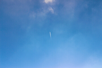 Airplane flying in the blue sky