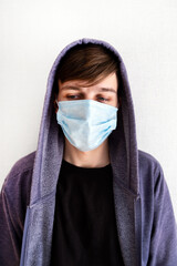 Sad Young Man in a Flu Mask