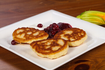 Pancakes with jam and berries