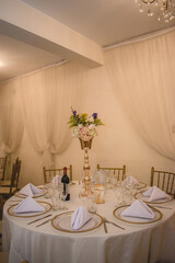Wedding table decoration with flowers and snacks