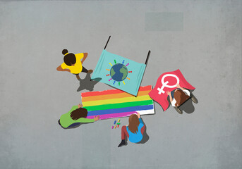 Women making gay pride posters
