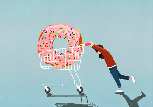 Girl pushing large sprinkle donut in shopping cart
