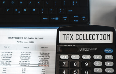 tax collection - concept of text on calculator display. Top view