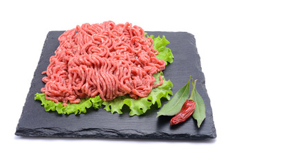 Fresh minced pork and beef and spices on a slate stone.Isolated on a white background, selective...