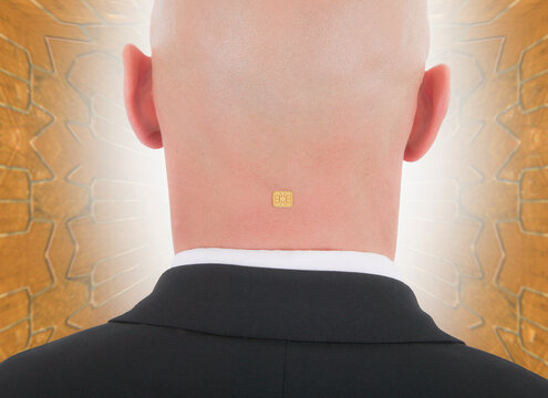 Close up businessman with computer chip in back of head
