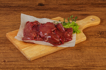 Raw chicken liver over board