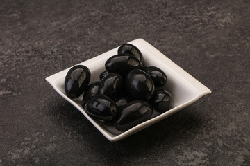 Pickled black olives in the bowl