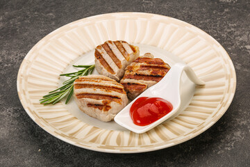 Grilled pork medallion with sauce