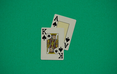 poker cards ace king on a green background. casino concept