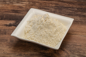 Wheat flour heap in the bowl