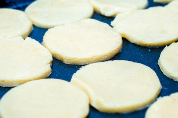 Fototapeta na wymiar homemade cakes cheese cookies before baking on a baking sheet