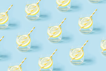 Summer pattern with glasses of lemonade on blue background.
