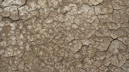 Cracked soil ground into the dry season, Broken clay pattern, Texture background