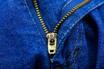 Zipper on the blue jeans. Hipster denim clothes. Close up.