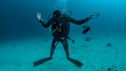 Naklejka na ściany i meble Diver at the bottom of the Red Sea