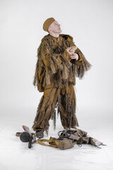 Actor male radio operator soldier of the Soviet army in old military uniform and camouflage clothes...