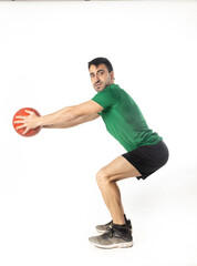 Fototapeta na wymiar man exercising with medicine ball on white background