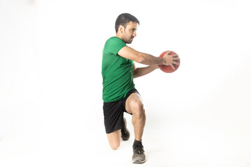 Fototapeta na wymiar man exercising with medicine ball on white background