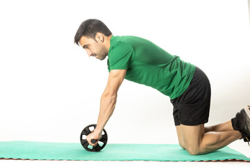 man with Ab roll Bodytone for abdominal strengthening. Small wheel that allows exercises to...