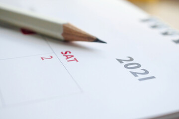 Obraz premium white pencil on 2021 calendar background business planning appointment meeting concept