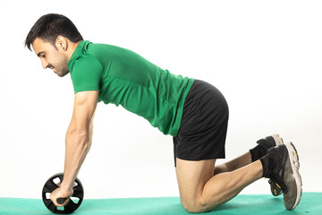 man with Ab roll Bodytone for abdominal strengthening. Small wheel that allows exercises to...