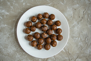 truffles with cocoa, coconut and sesame seeds with chocolate and marshmallows, delicious dessert