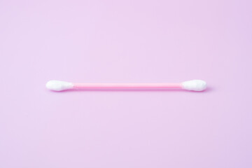 Cotton swabs isolated on pink background. Beauty and hygiene concept.