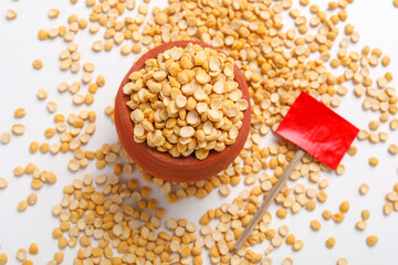 Dried chickpeas pulses in bowl isolated on white background.
