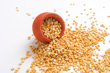 Dried chickpeas pulses in bowl isolated on white background.