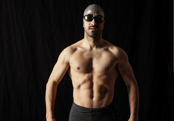 Fototapeta na wymiar swimming pool man black background