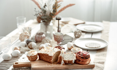 Easter table setting with decor details and homemade cakes.