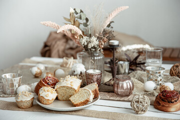Fototapeta na wymiar A beautifully set table for Easter with decorative details and pastries.