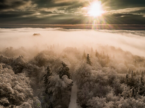 Magnificent view from Watchtower in the mountains during the winter. Land covered by snow, peace in soul during amazing sunset. - Powered by Adobe