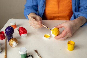 Preparing for Easter. Decorating - painting eggs.