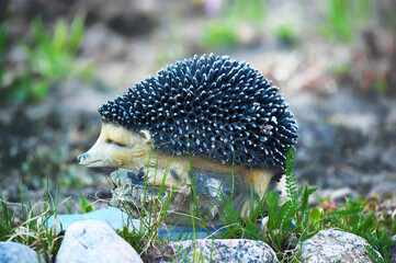 garden sculpture hedgehog among the grass
